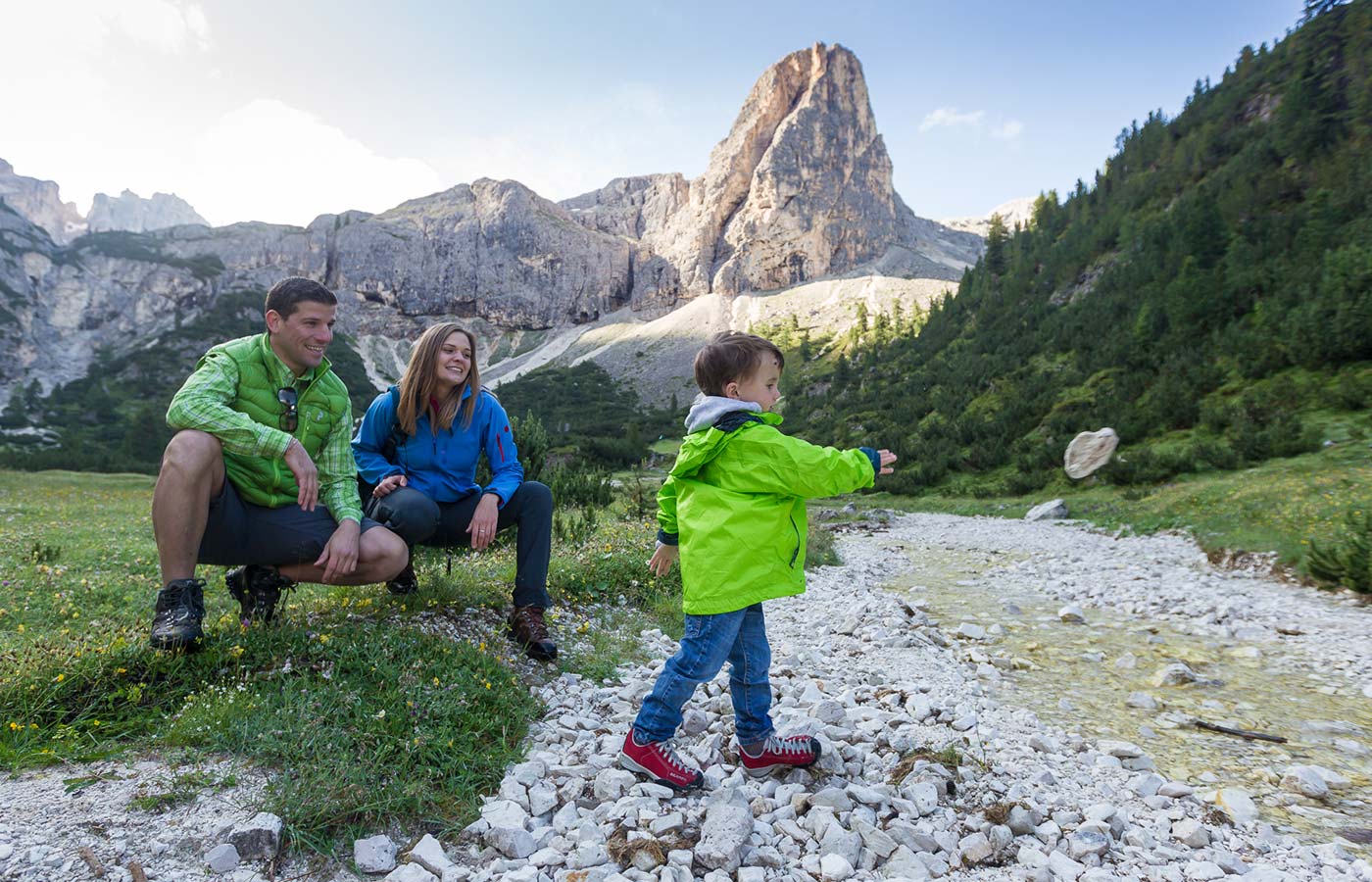 Family hiking trip with view of the Dolomites